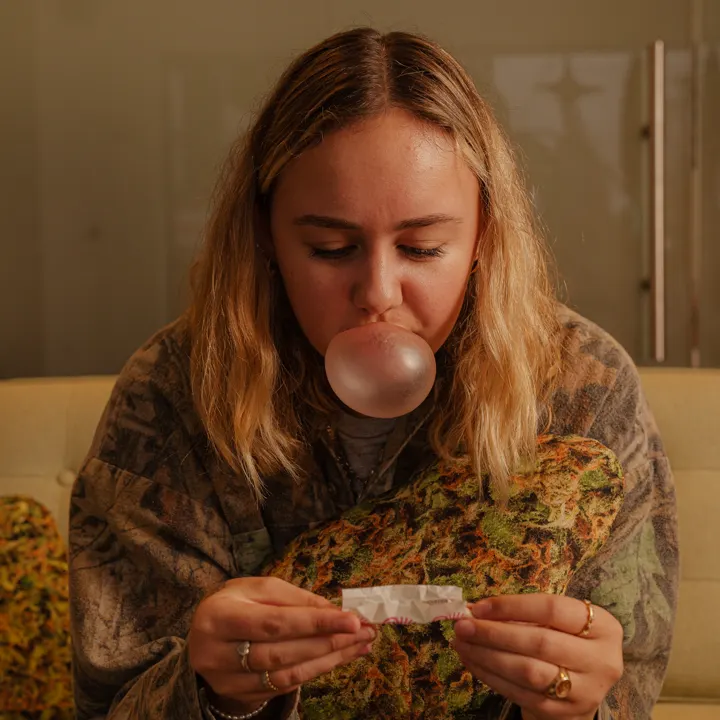 Customer rolling a joint at Coastal Green