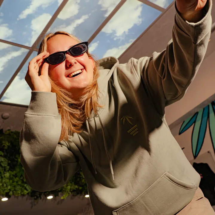 Customer in sunglasses under the skylight at Coastal Green